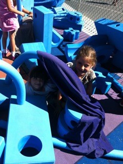 girl playing in imagination playground